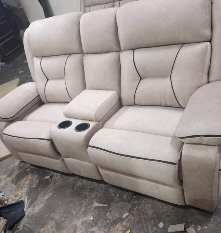 Light Cream color recliner sofa seats in afsar sofa repair.