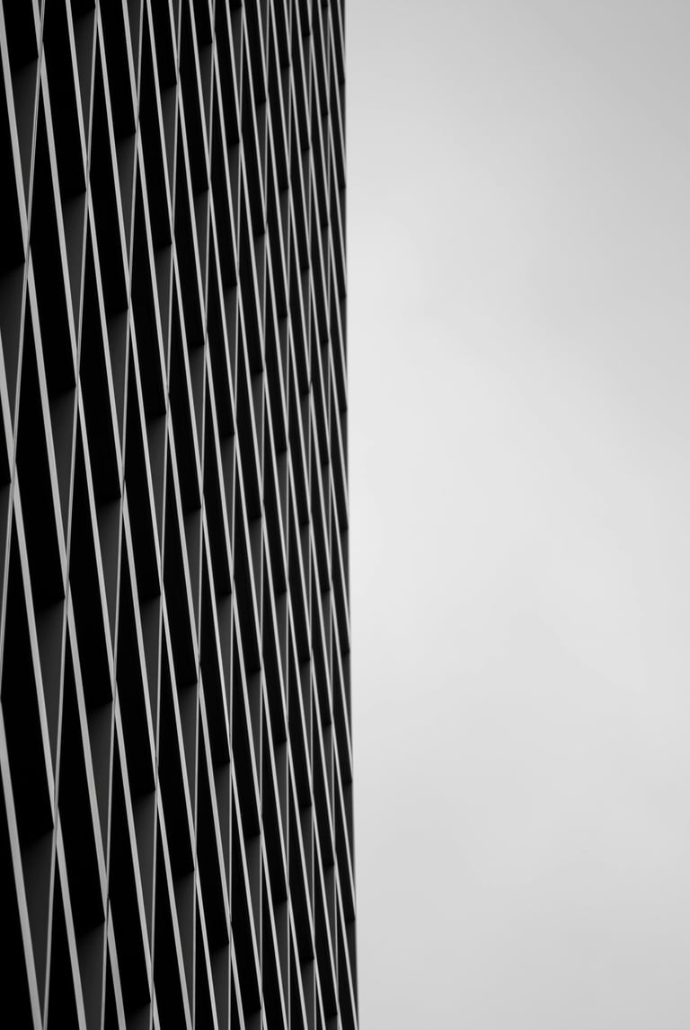 Modern architectural detail featuring a geometric mesh screen.
