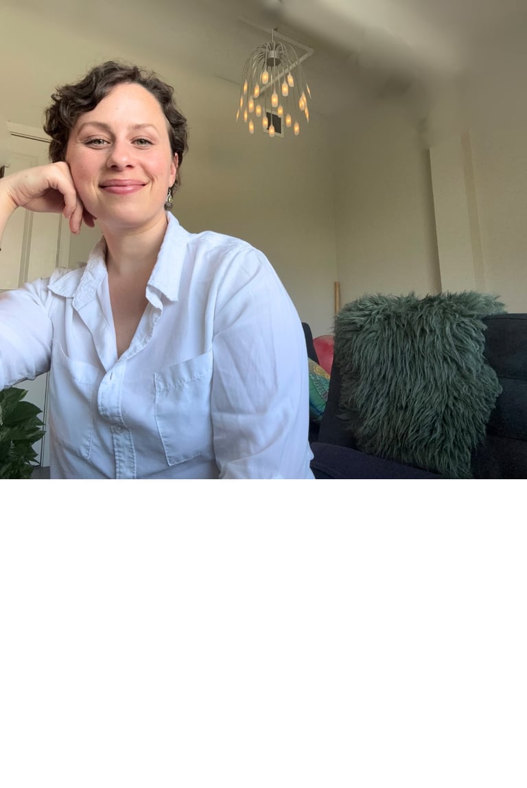 a woman in a white shirt and a black couch