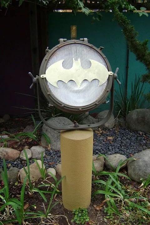 Outdoor search light with brass bat signal on the lens.