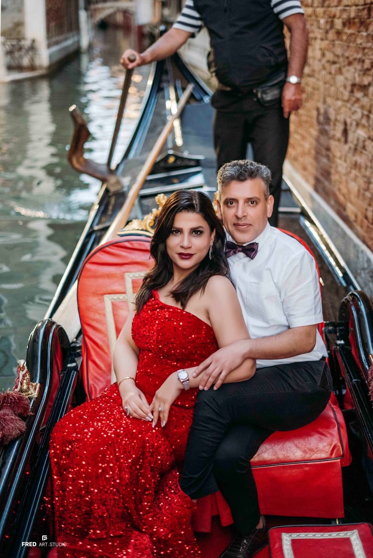 Couple by gondolas in Venice