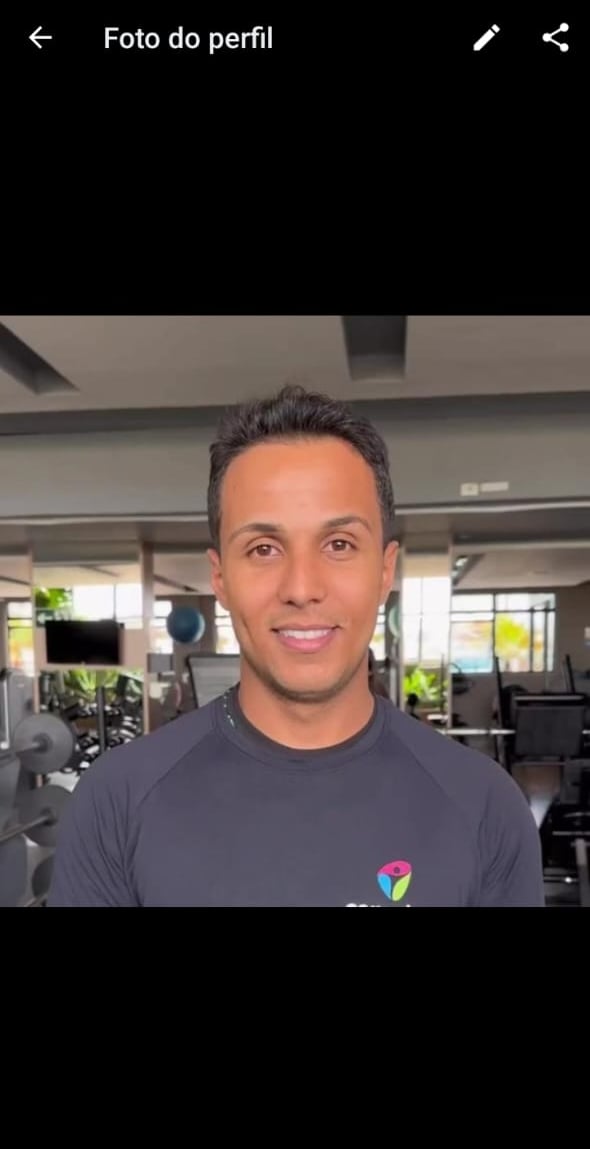 a man in a gym with a video chat