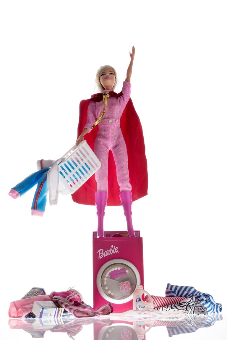 a barbie doll with a pink outfit and a pink dress