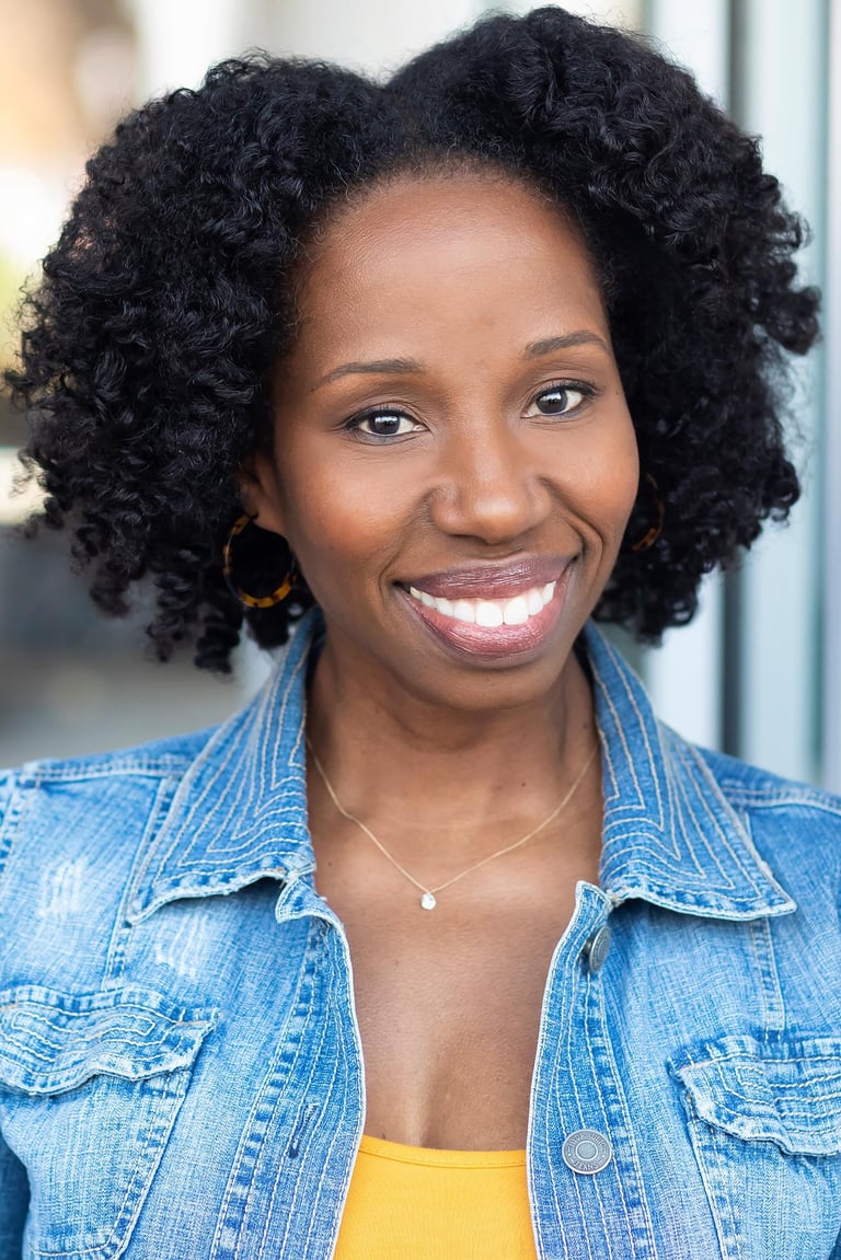 Headshot of Tracie Frank with a bright, friendly smile.