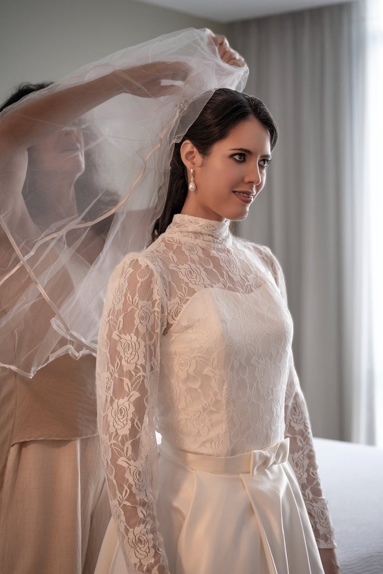 a bridesmaid in a wedding dress with a veil