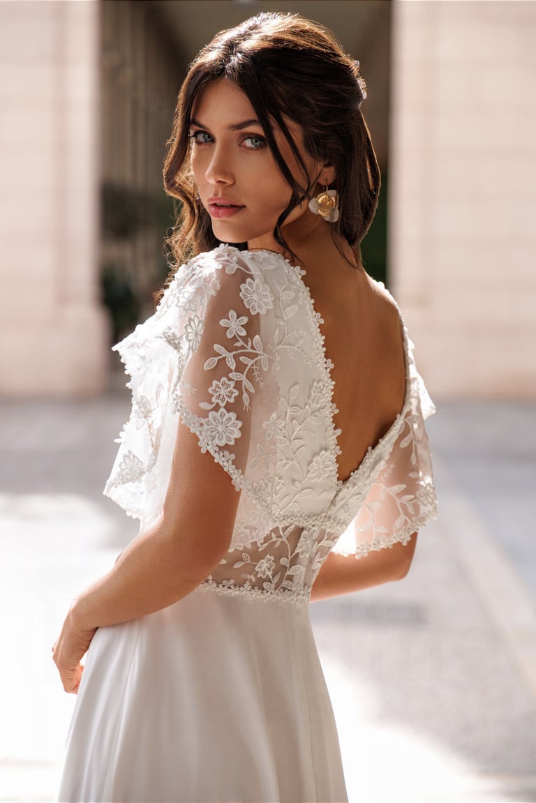 a woman in a white dress with a white dress