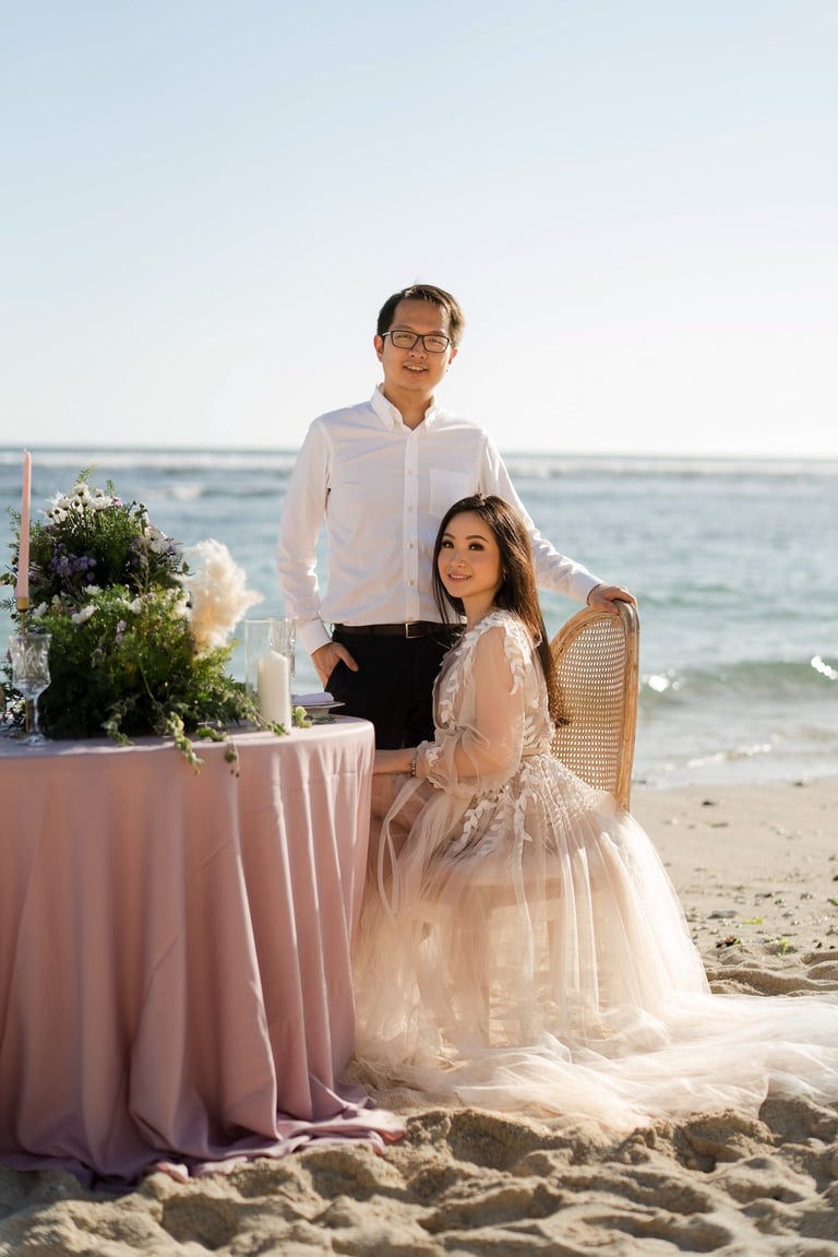 Intimate couple portrait at styled table on Melasti Beach Bali