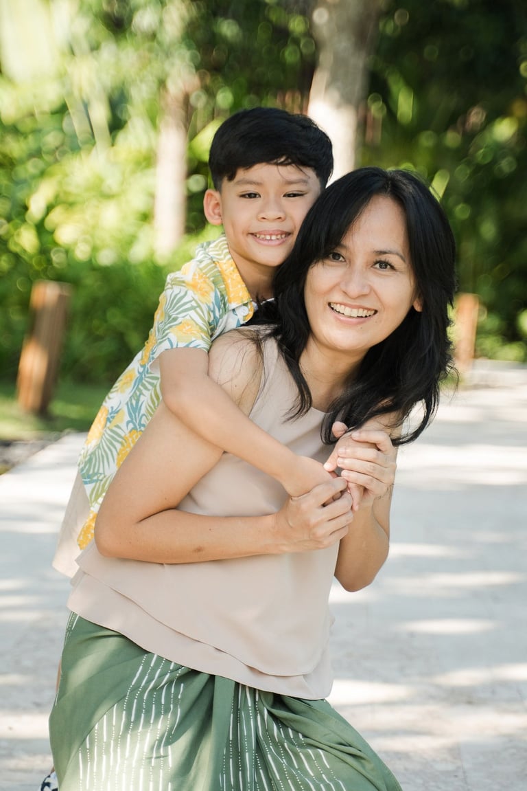 Parents walking with their children at The Meru Sanur Bali family photography session