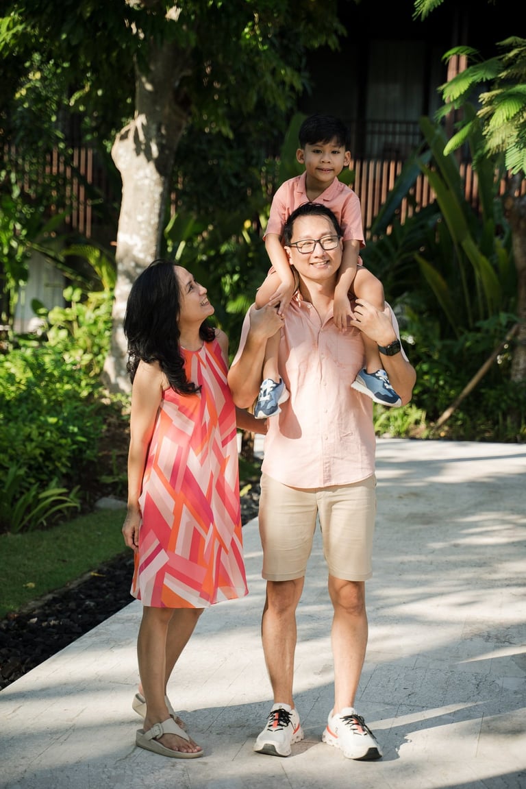 Father carrying child on his shoulders at The Meru Sanur Bali family photography