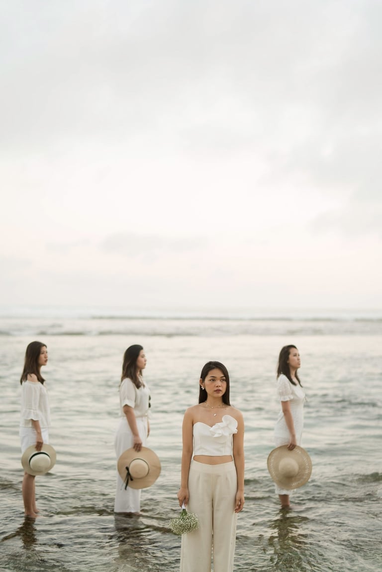 Bachelorette party group standing in ocean water at Melasti Beach Bali