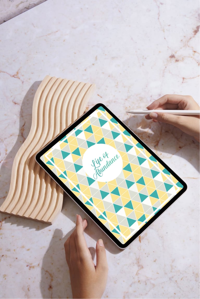 Digital planner on a tablet with a stylus on a marble surface for productivity and organization.