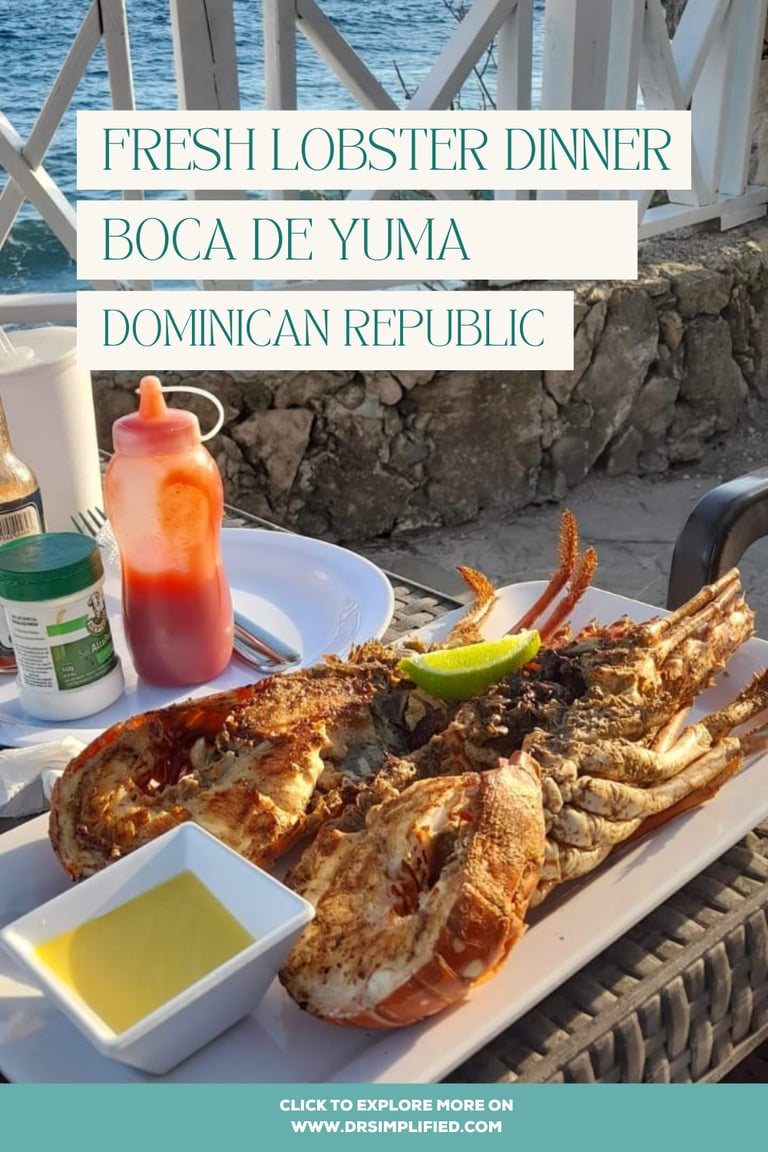 Grilled lobster dinner served with butter and lime at an oceanfront restaurant in Boca de Yuma, Dominican Republic