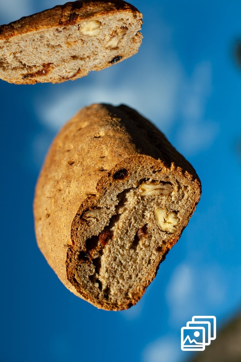 a piece of bread flying with a slice of bread the top of it