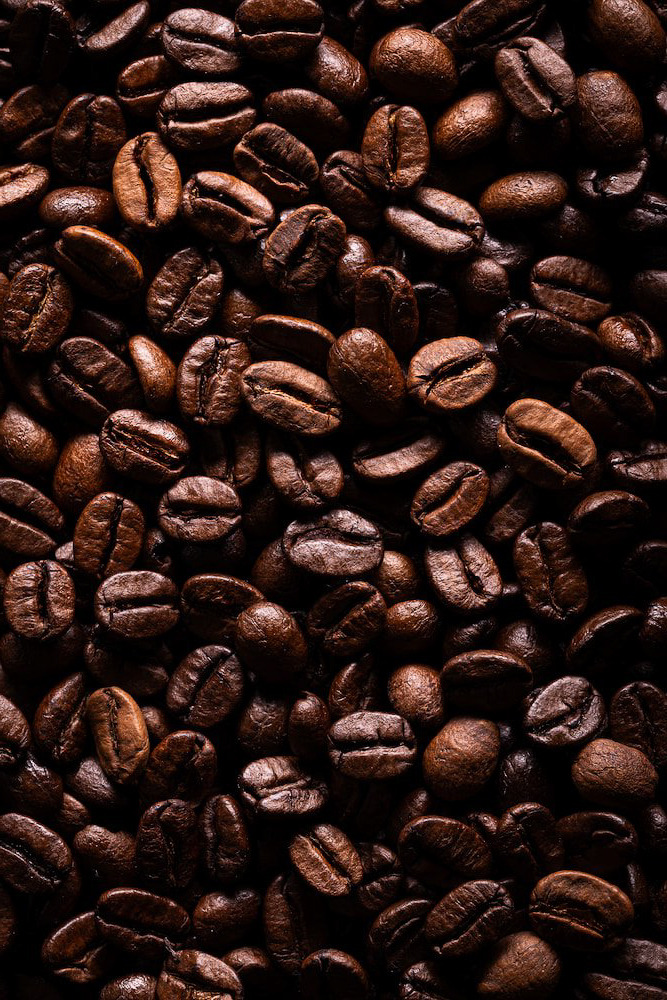 a close up of a pile of coffee beans