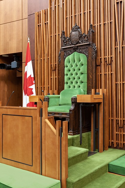 a green chair with a canadian flag