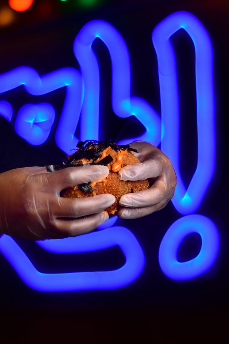 a person holding a kimchi bomb in their hands