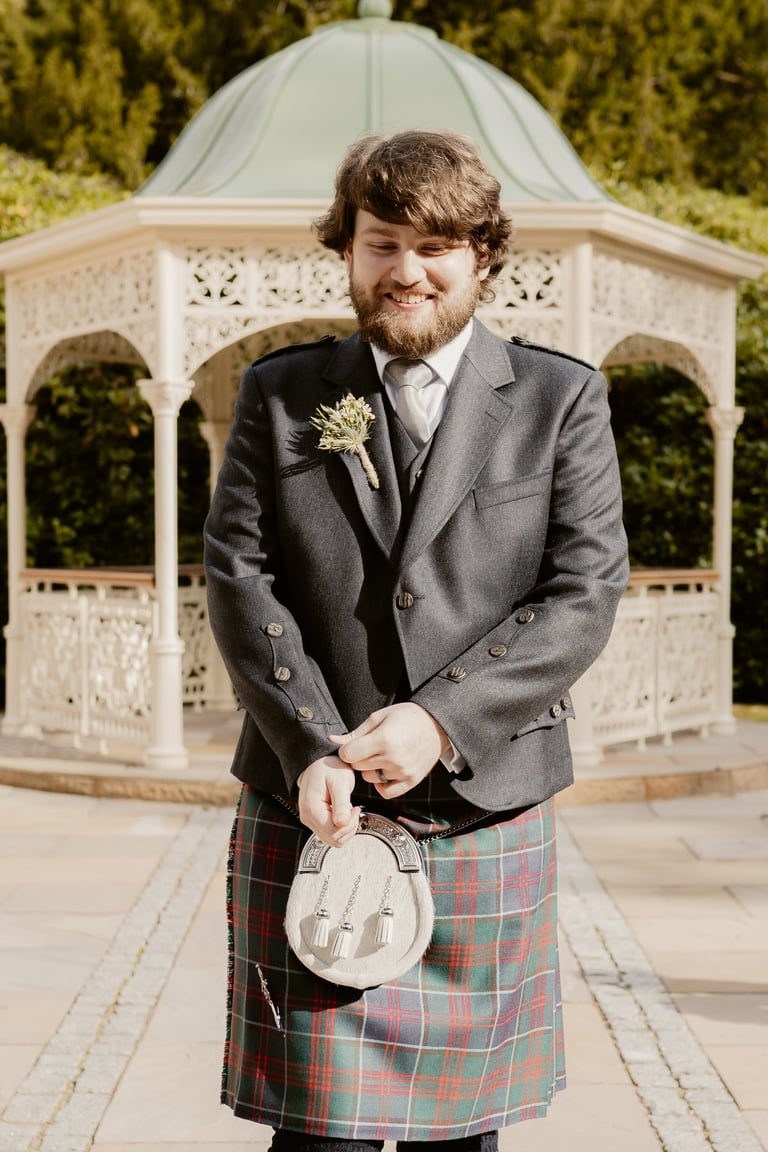 a man in a kiltrum kilt and a kilt