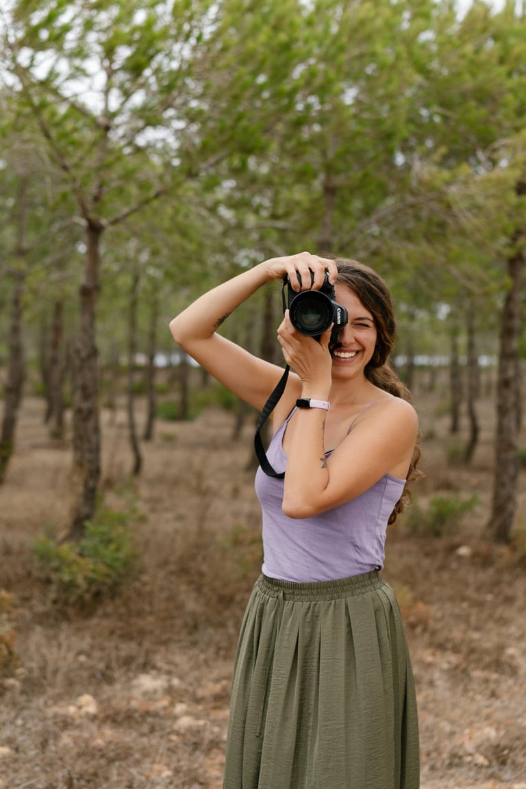 a woman taking a picture of herself taking a picture of herself