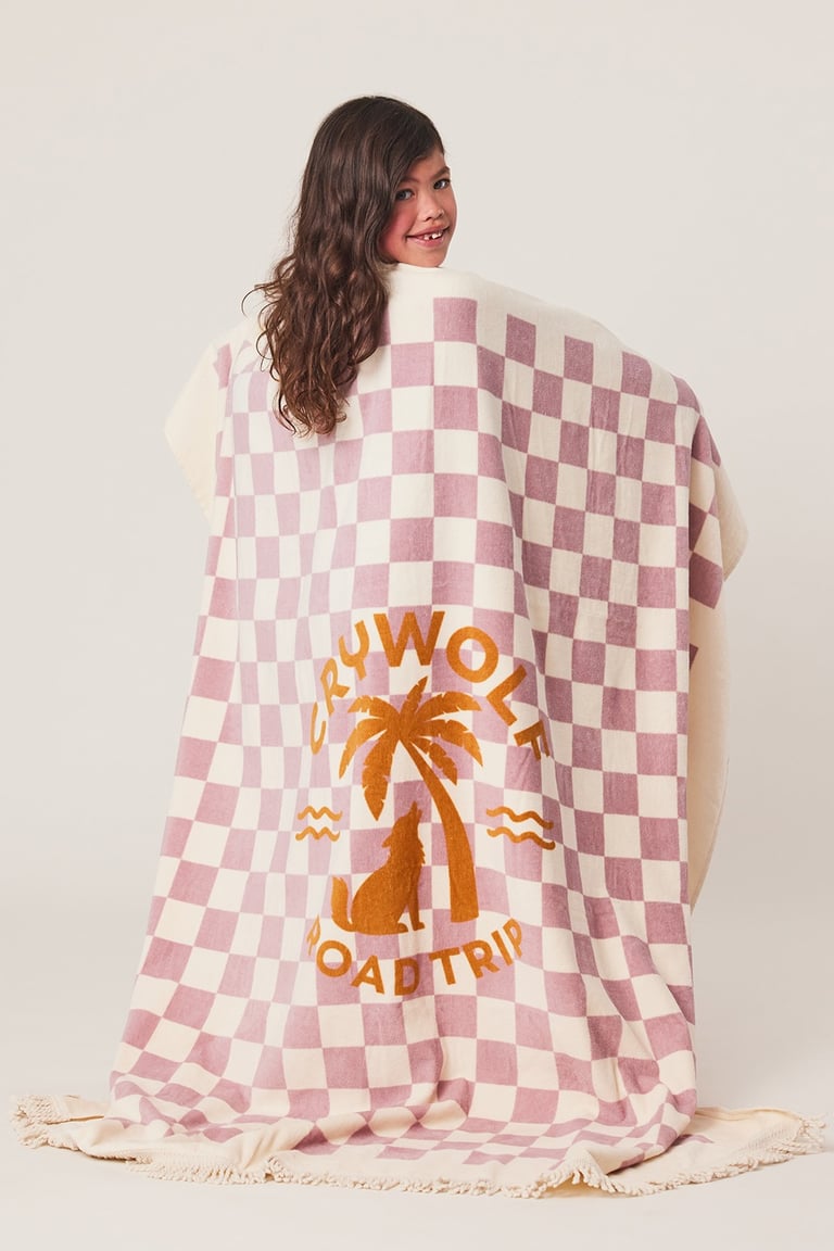 Product photography - a woman in a checkered blanket