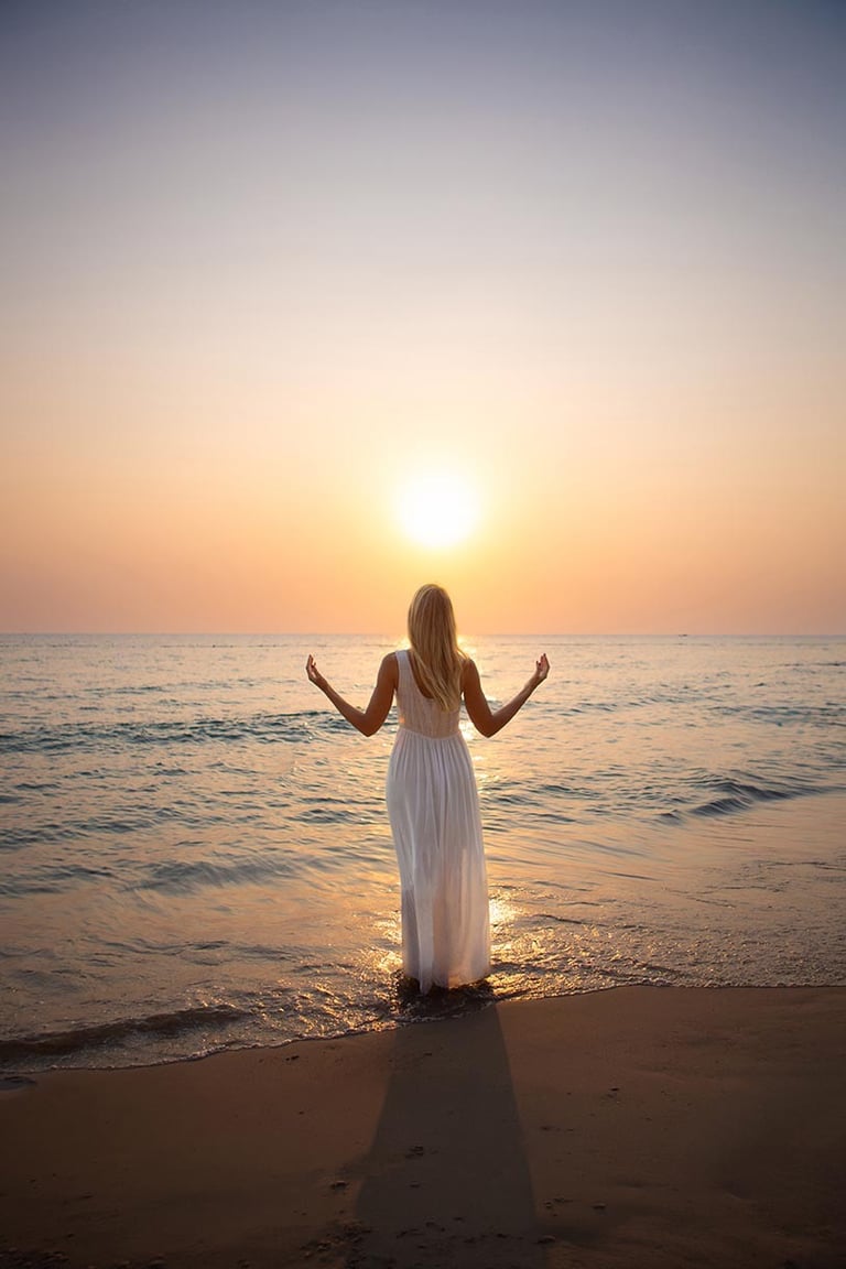 Woman standing in the ocean during a sunset personal branding photoshoot in Phu Quoc