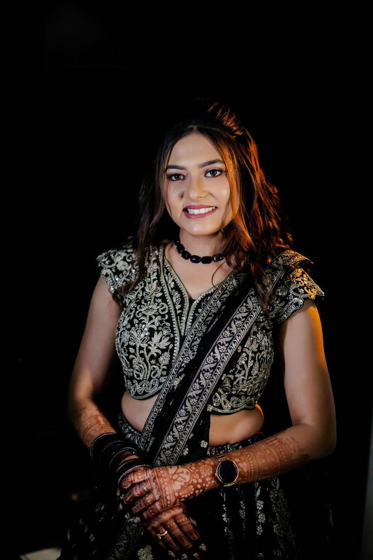 Beautiful Indian bride in black lehenga choli with detailed bridal makeup, flawless base, bridal hai