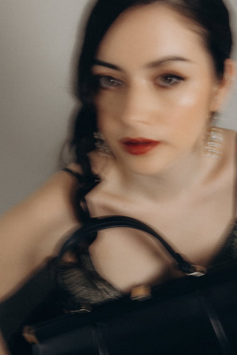 a woman with a purse and a black purse