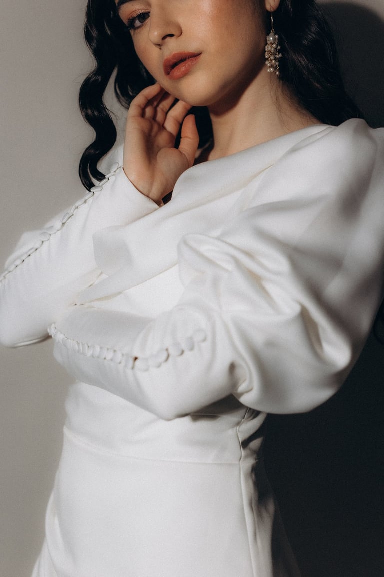 a woman in a white dress with a white dress