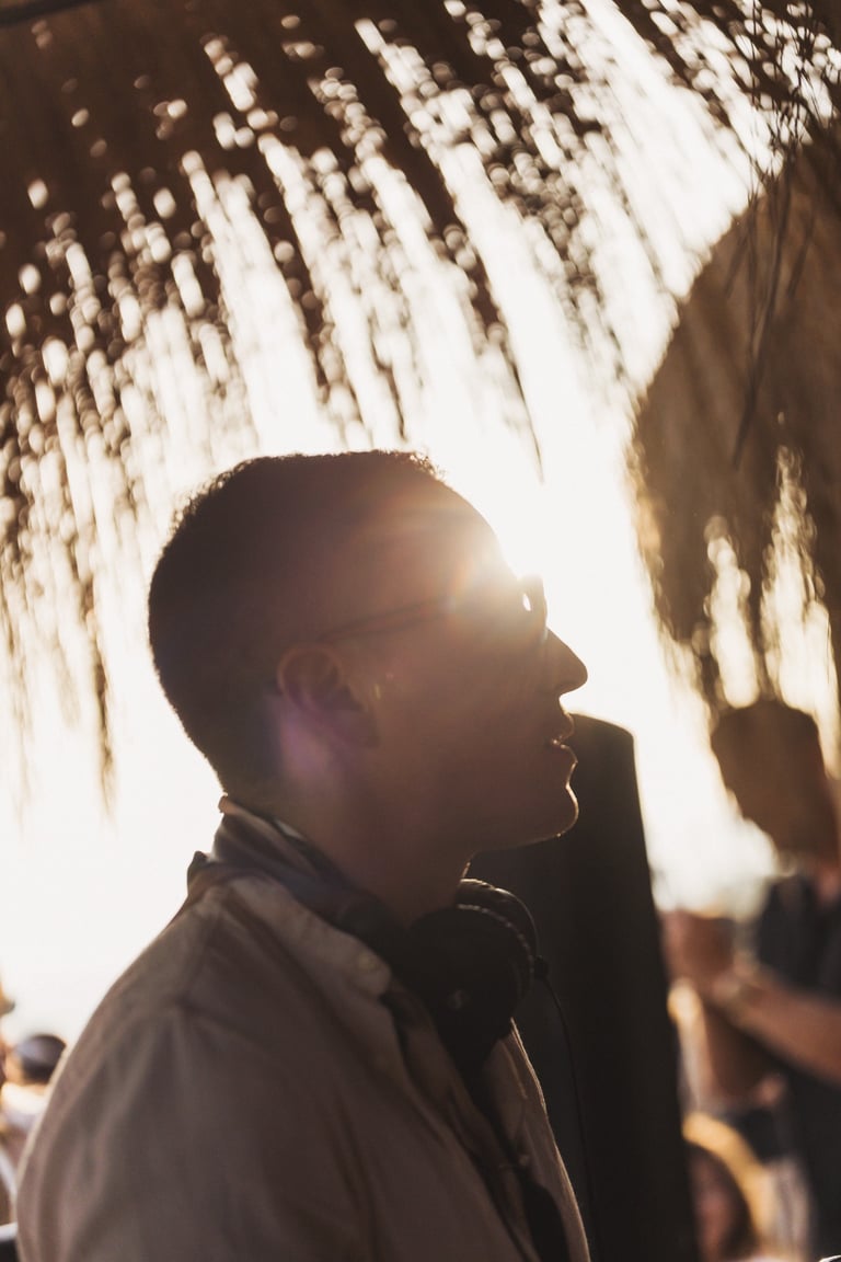 DJ Miguel Cuartín at the decks of SOLÉ, showcasing the signature sound and musical journey
