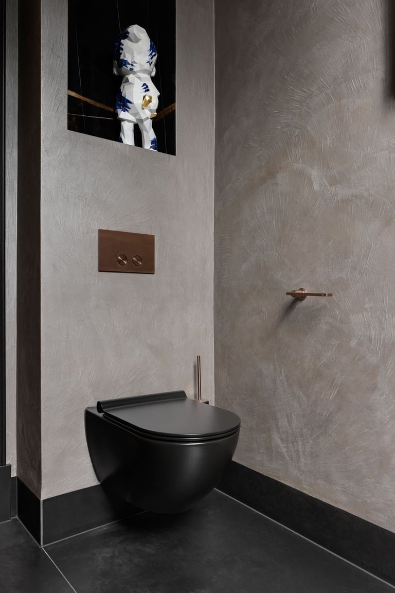 A modern and luxurious bathroom featuring multi-coloured microcement