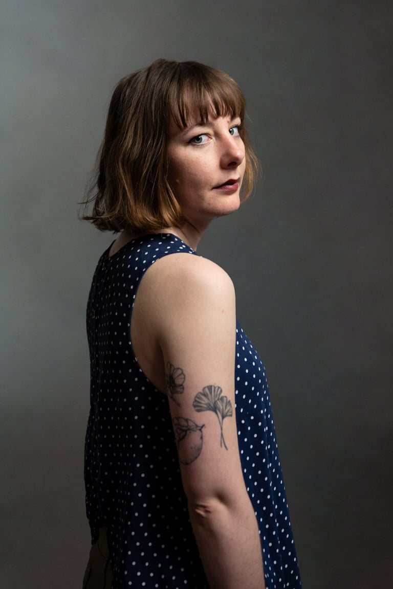a woman with a tattoo on her arm