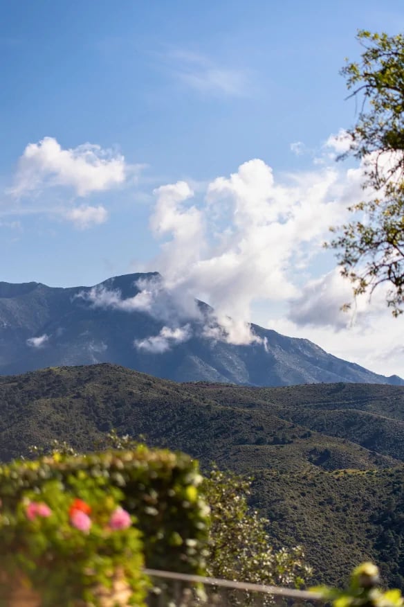 Mountain view with clouds and greenery at Finca Santa Katerina