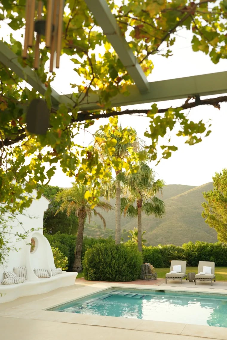 Private pool terrace with mountain views and shaded pergola