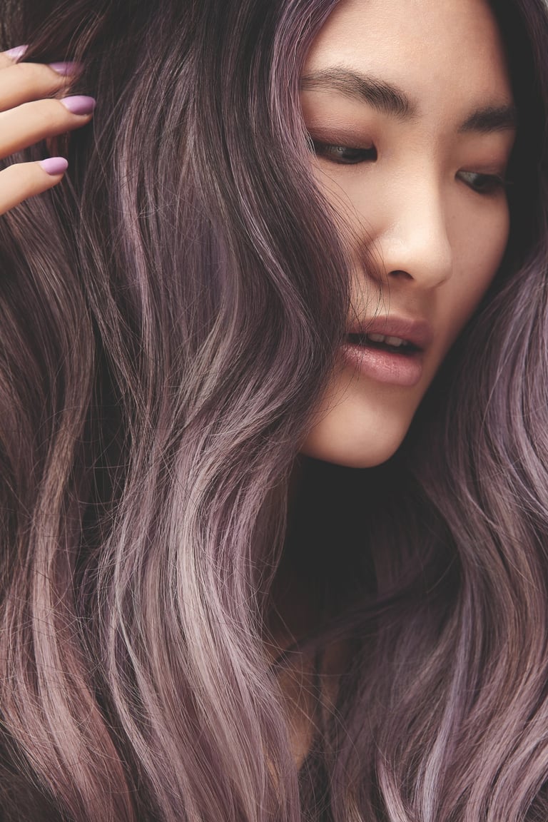 a woman with long hair and purple hair