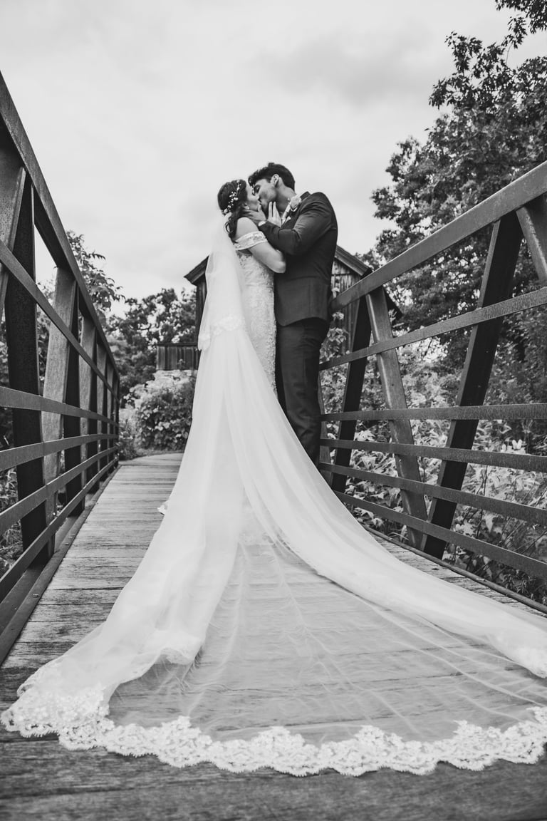 black and white bride and groom portrait, full length cathedral veil