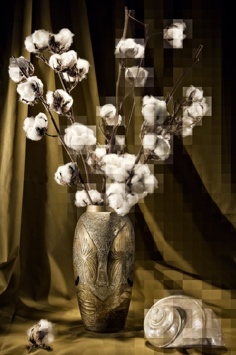 a vase with cotton flowers in a vase