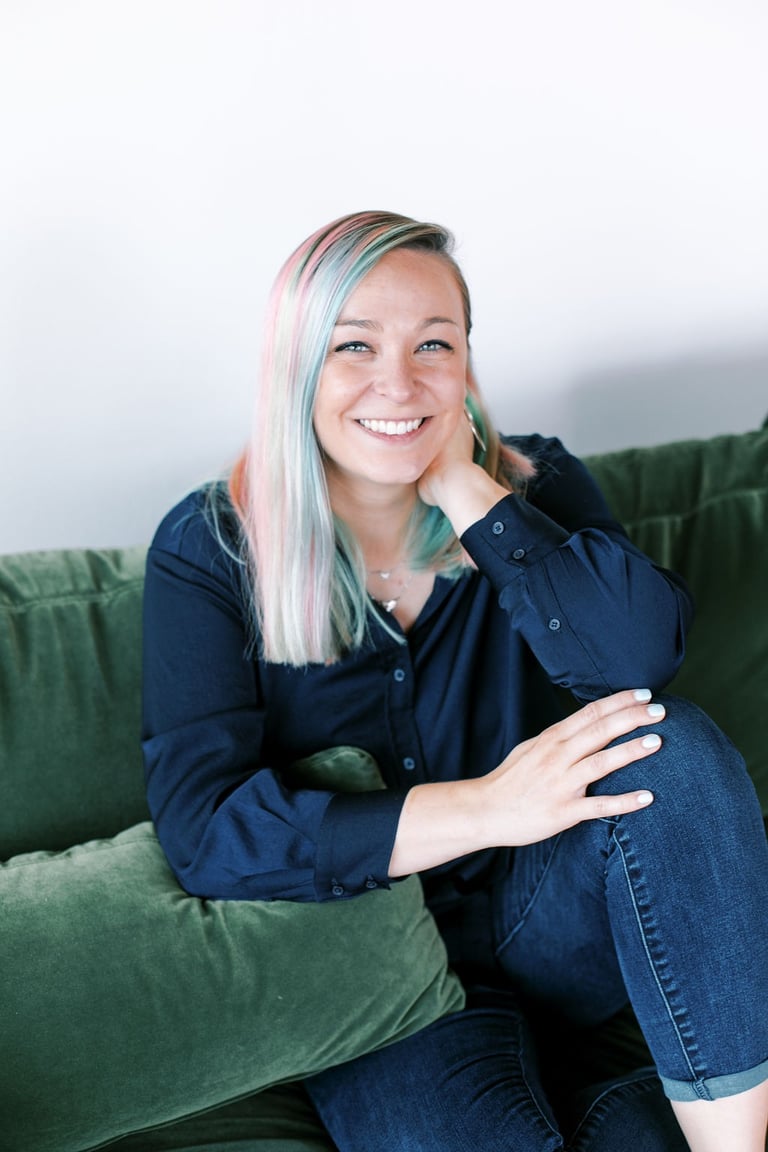 Tabitha with butterfly effect consulting on a couch