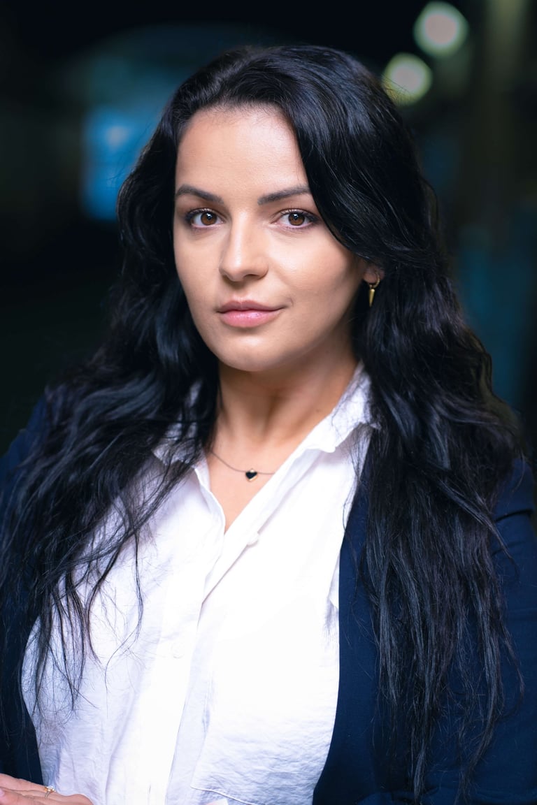 a woman with long hair and a white shirt