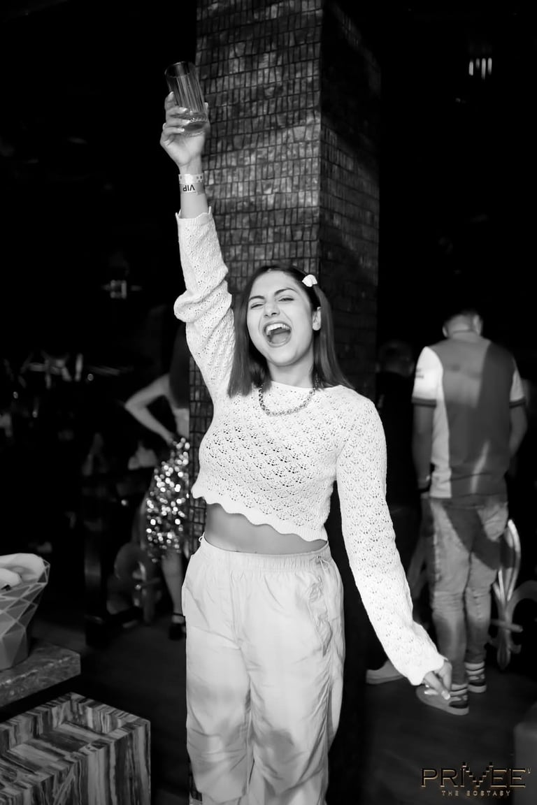 a woman in a white sweater and pants with a white sweater