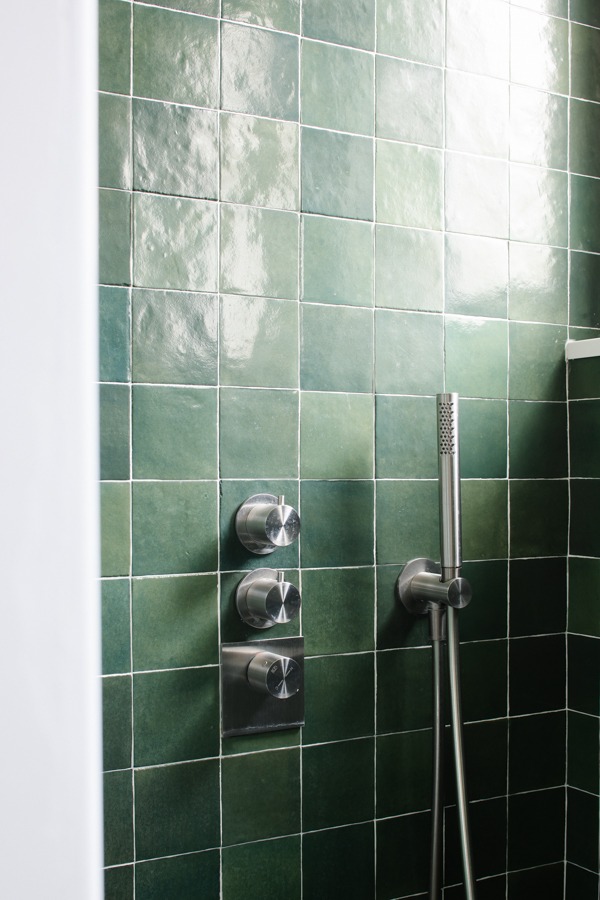 a shower with a shower head and a shower head