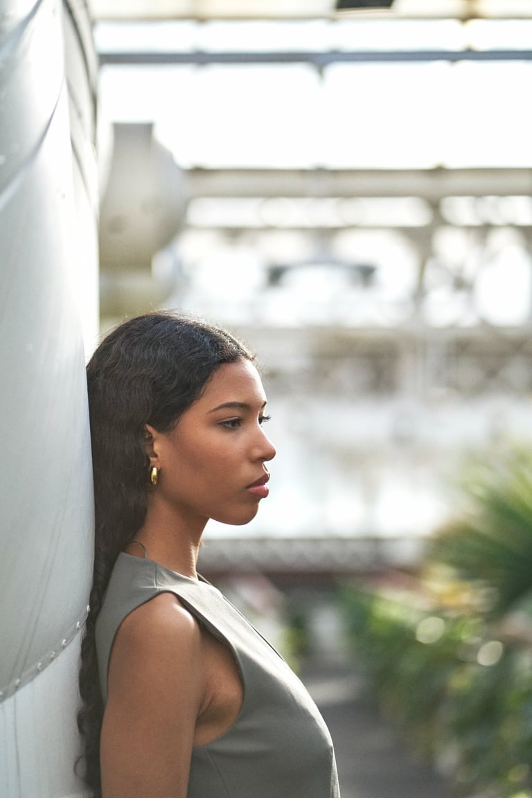 black girl posing in profile for a photo session