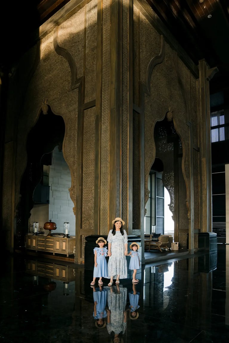 Family photography inside The Grand Lobby at The Apurva Kempinski Bali with dramatic architectural interiors