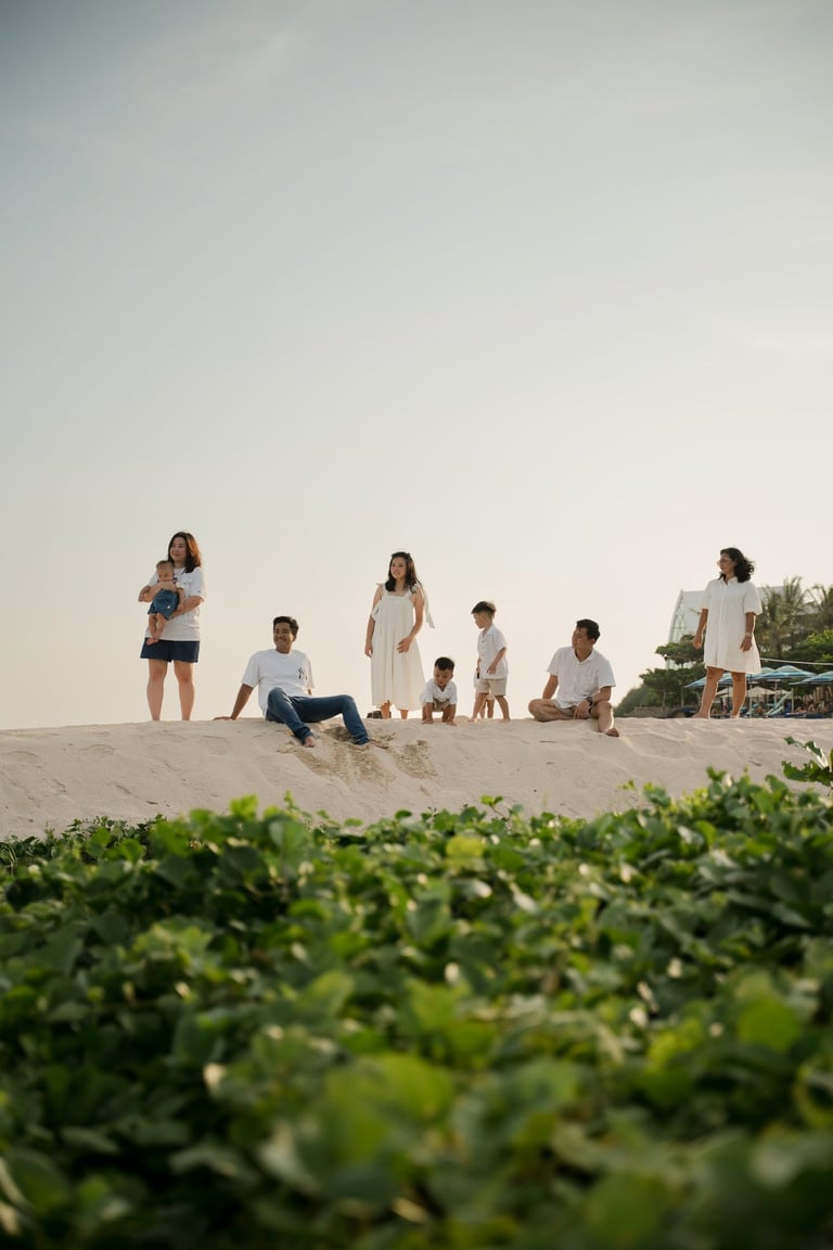 Children exploring the coastline during a family photography session at The Apurva Kempinski Nusa Dua Bali