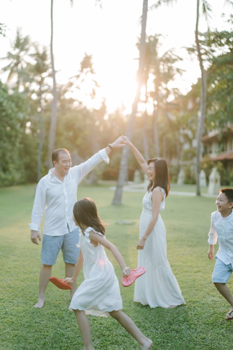 candid family moment at Westin Bali with warm sunset light