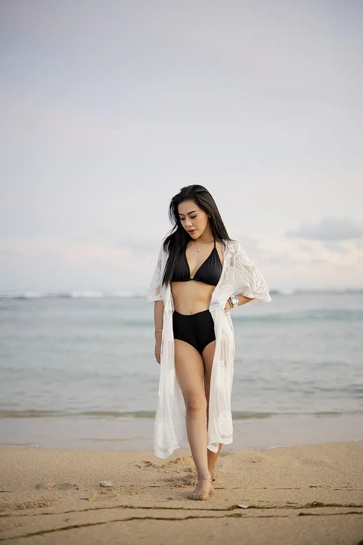Lifestyle fashion portrait on the beach at The Apurva Kempinski Bali