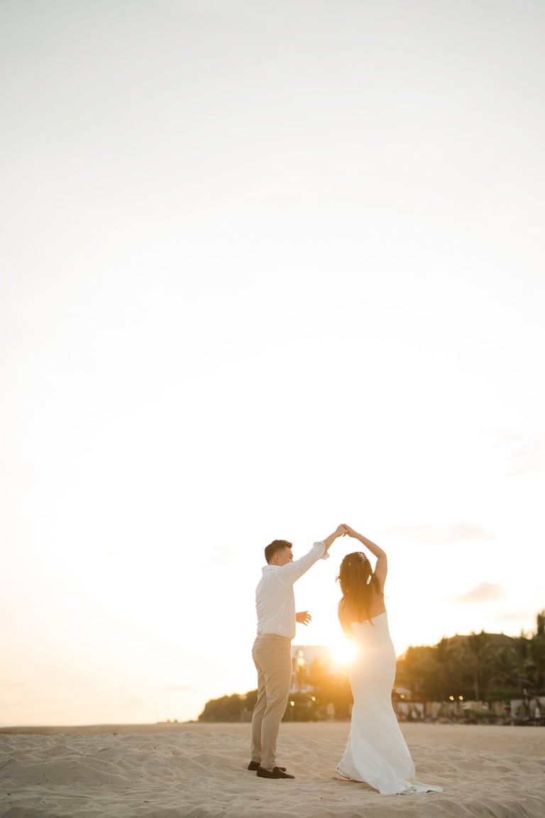 Couple Dancing together during golden hour prewedding photoshoot at Apurva Kempinski Bali beach