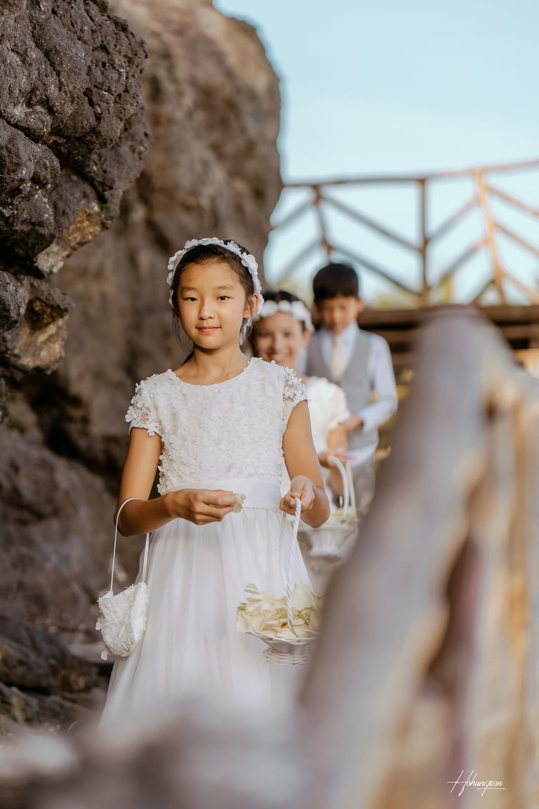 a young girl in a white dress and a man in a suit and tie