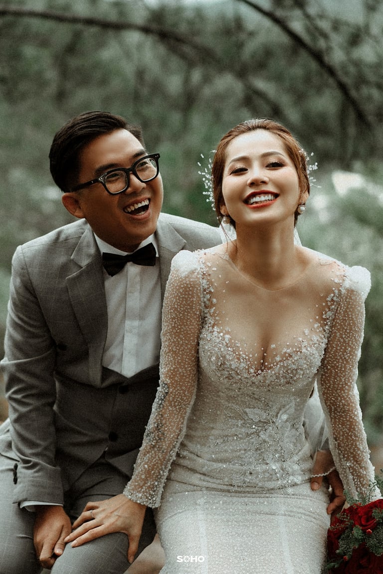 a man and woman are smiling and laughing