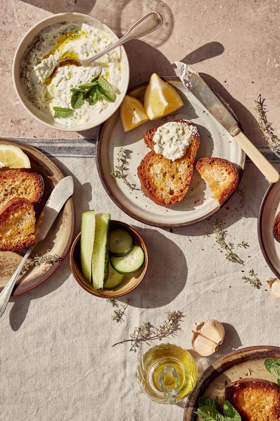 Tzatziki with toasted bread and fresh herbs-a dish prepared by the chefs of Villa Eats in Naxos 