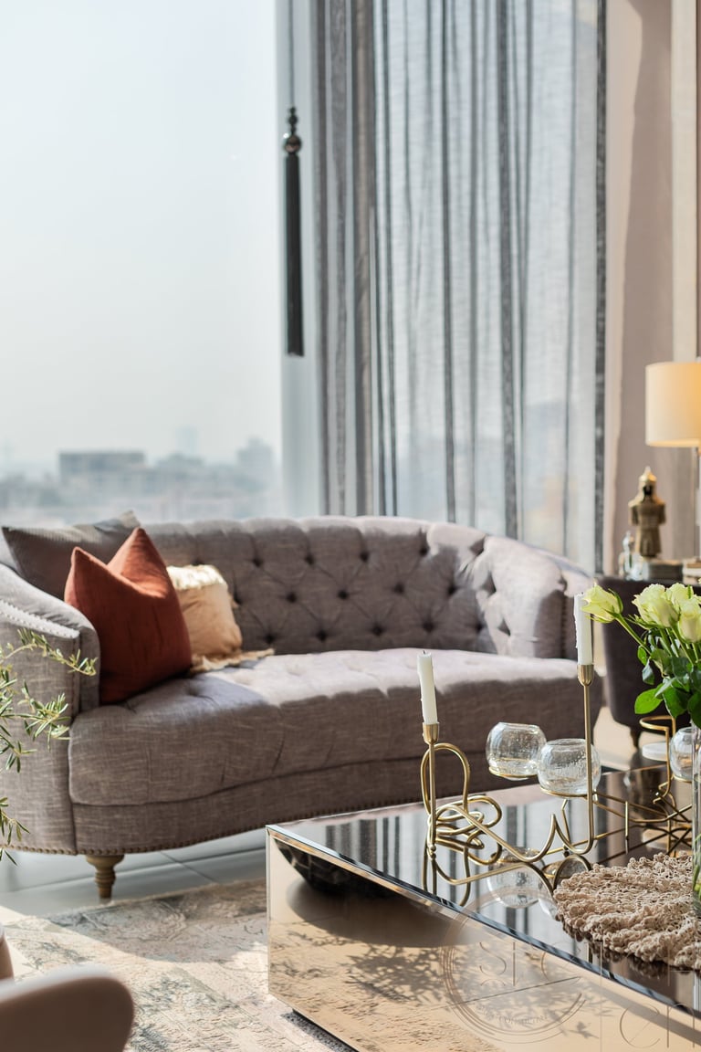 a living room with a couch and a table, interior design