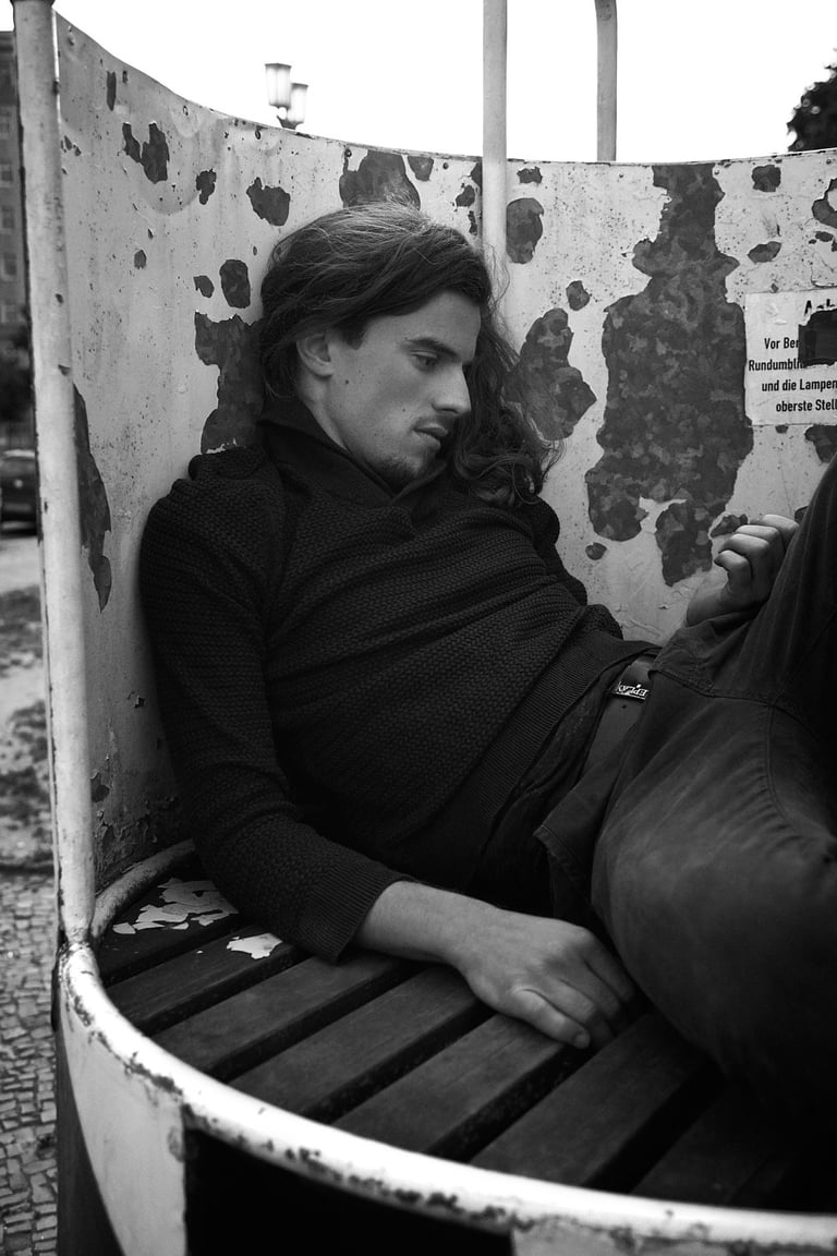 A black and white portrait of a bored man.